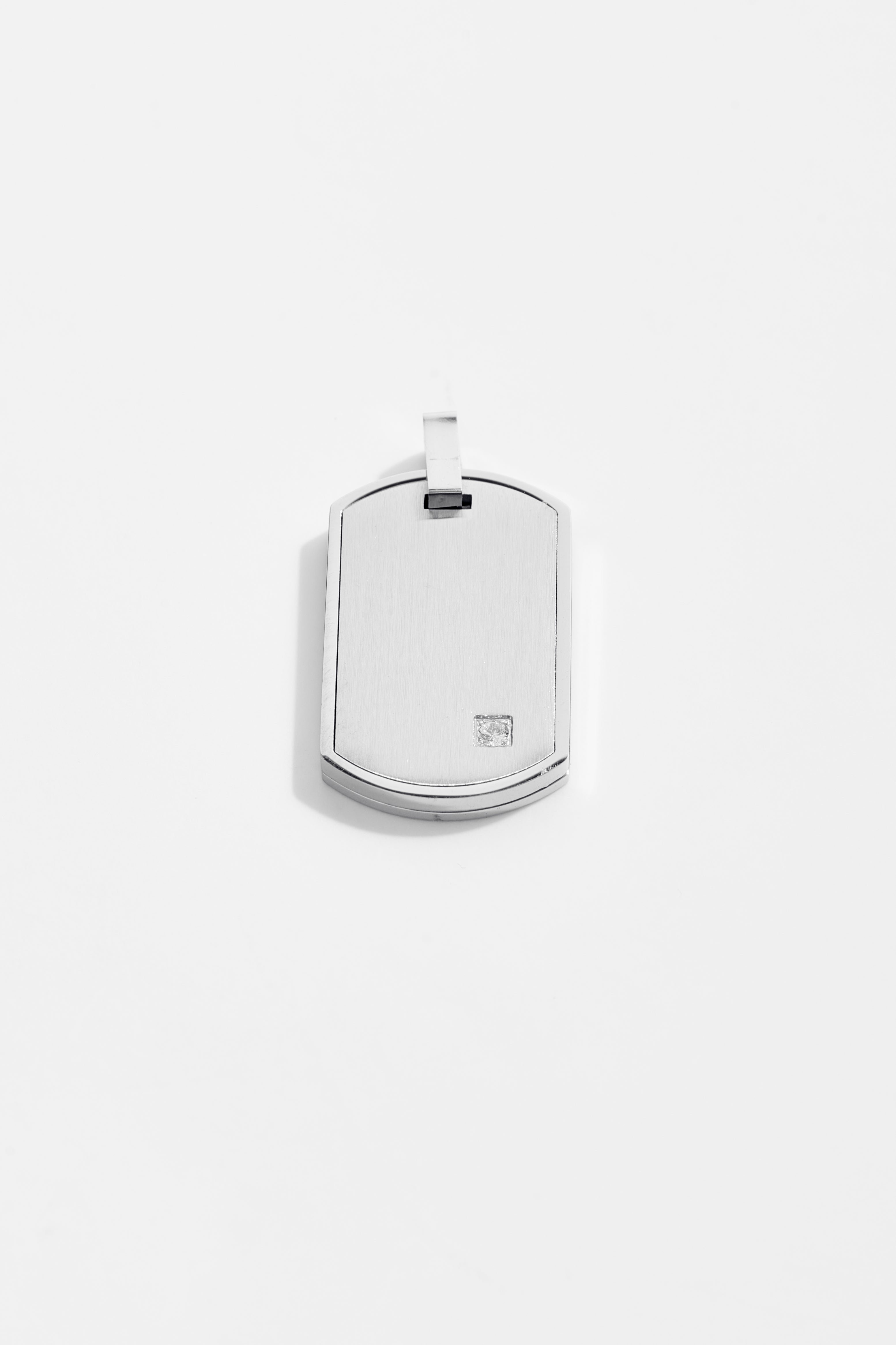 Tag pendant with cubic zirconia accent