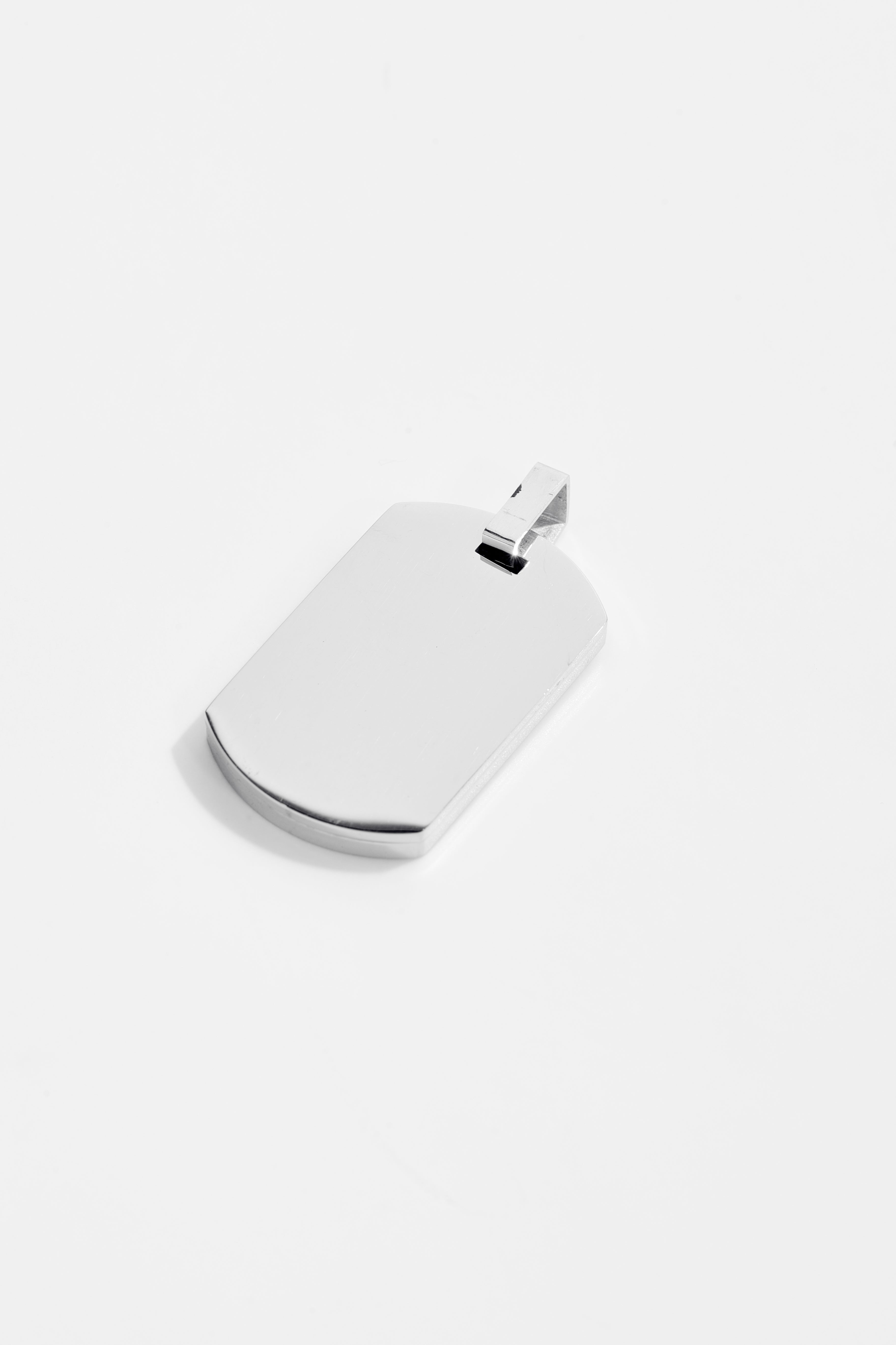 Tag pendant with cubic zirconia accent